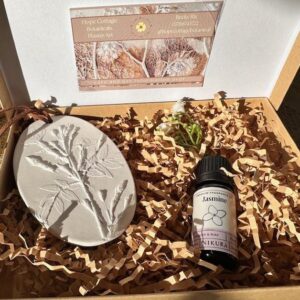 Room infuser beautiful handmade hanging plaster diffuser, cast from real Jasmine flowers. With a bottle of gentle jasmine fragrance.