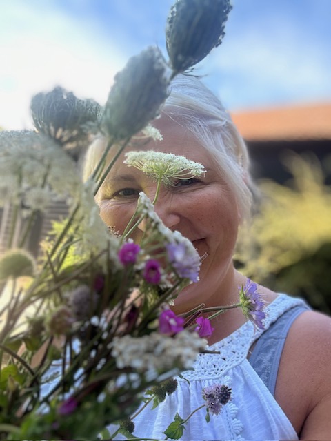 Becky hidden by flowers
