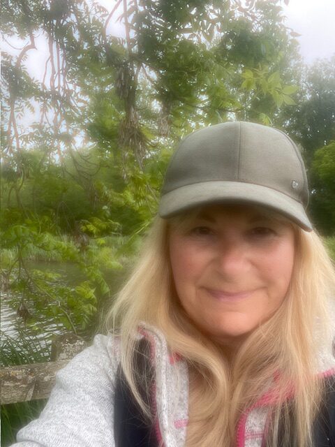 Becky in front of a river